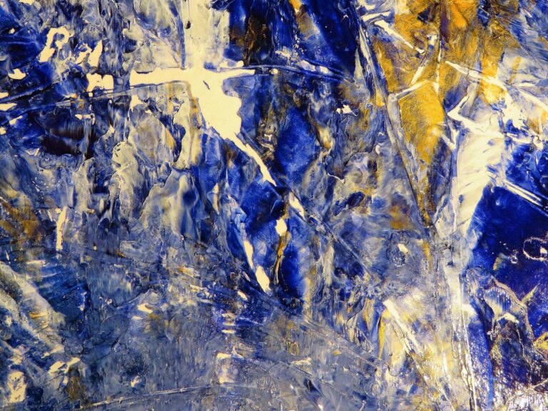 Dynamic abstract art with vivid blue and gold textures, perfect for creative backgrounds.